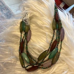 Multi colored beads. Purple, jade and lavender.